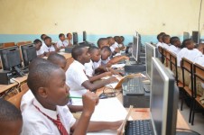  Students in the computer lab with their teacher during the lesson 